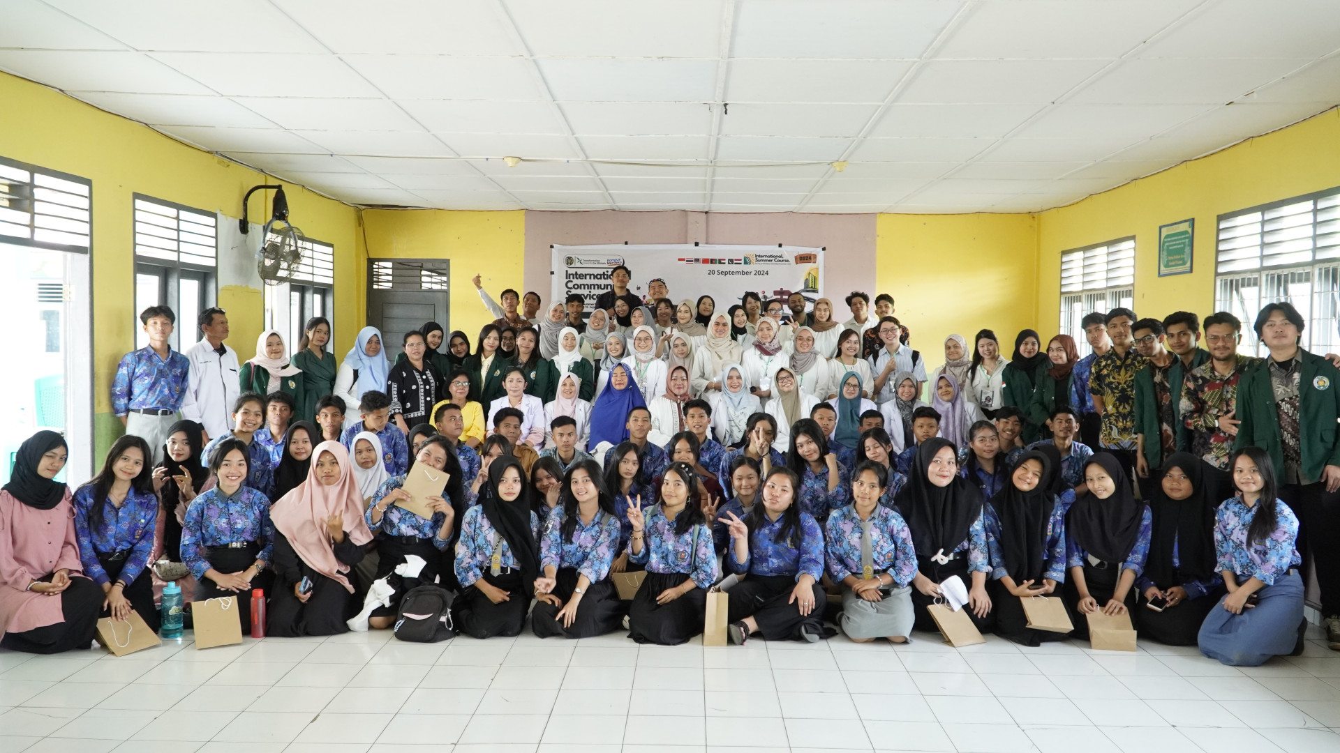 International Summer Course 2024 Participants Engage in Community Service at SMK Gajah Mada Medan: Oral and Dental Health Education for Young People