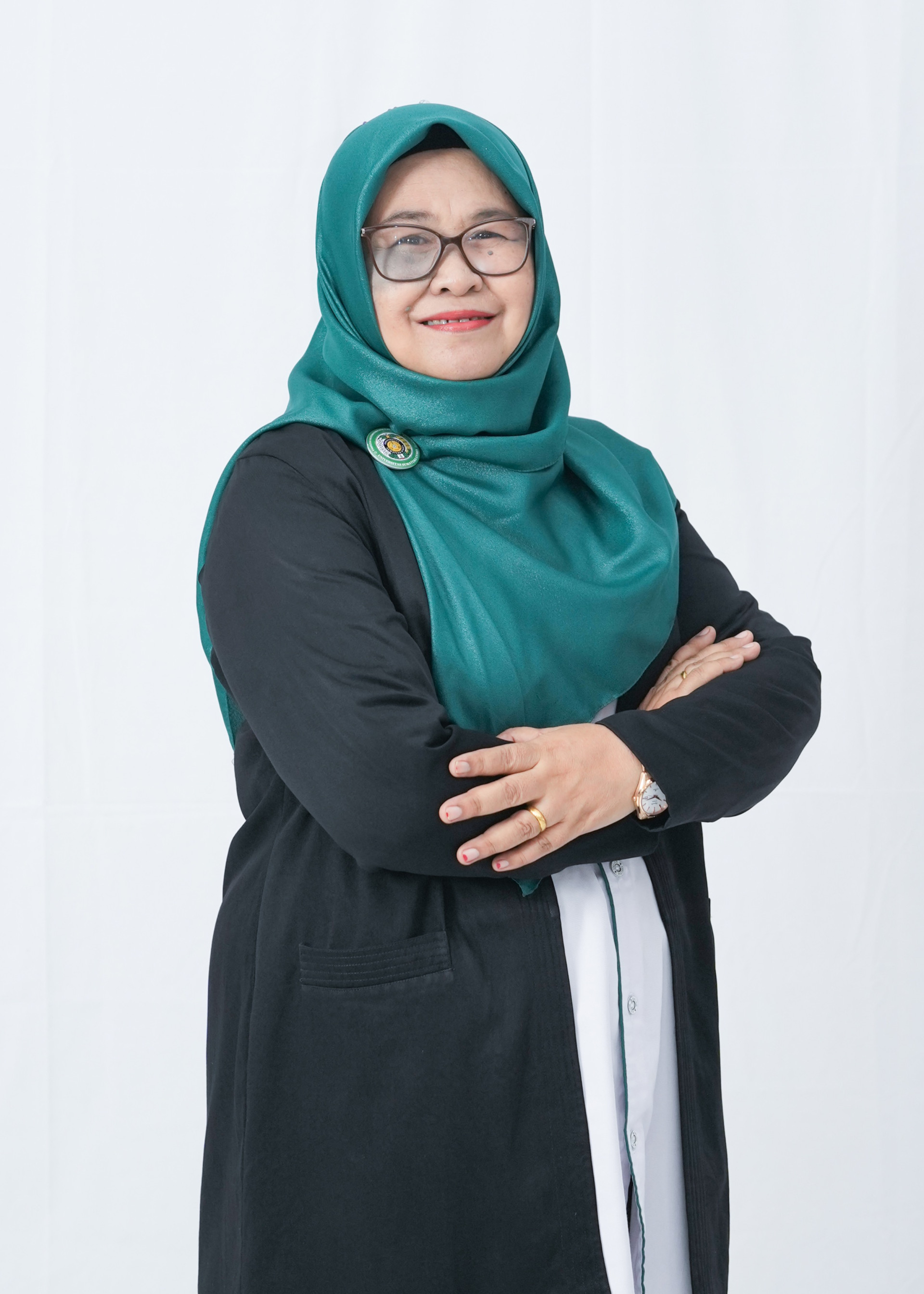 Dr. Dra. Elimasni, M.Si